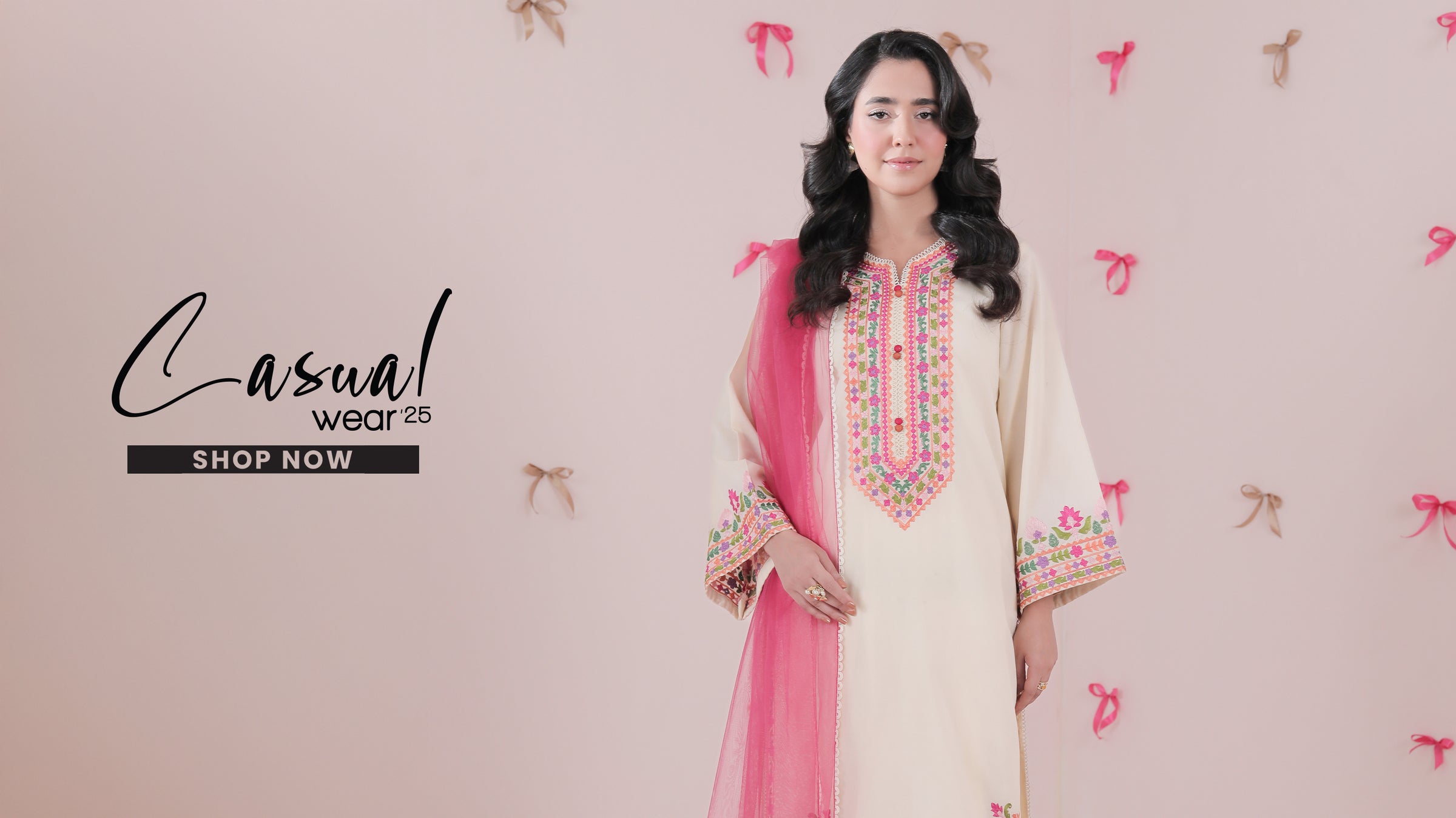 Woman wearing a traditional outfit with pink dupatta against a light pink background with decorative elements.