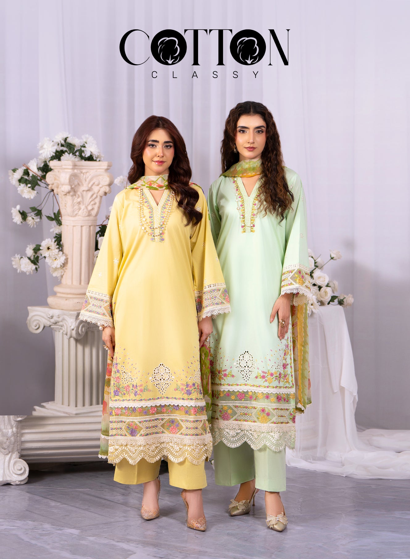 Two women wearing light green and yellow outfits with floral patterns, standing in a decorated indoor setting. Brand 'Cotton Classy' is visible.
